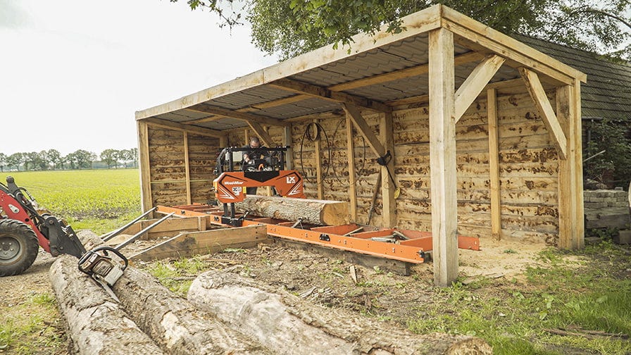 The log loading with a forklift at LX50 sawmill